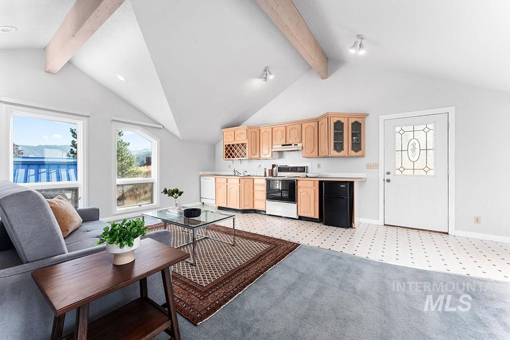 Living area featuring light colored carpet and wet bar