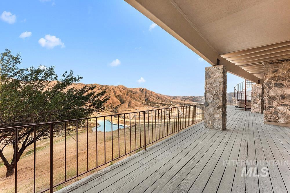 Wooden deck featuring a mountain view