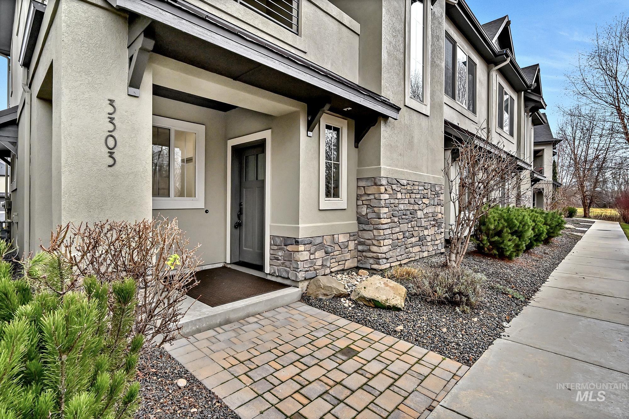 View of your walk along the private tree-lined sidewalk to your covered entry.