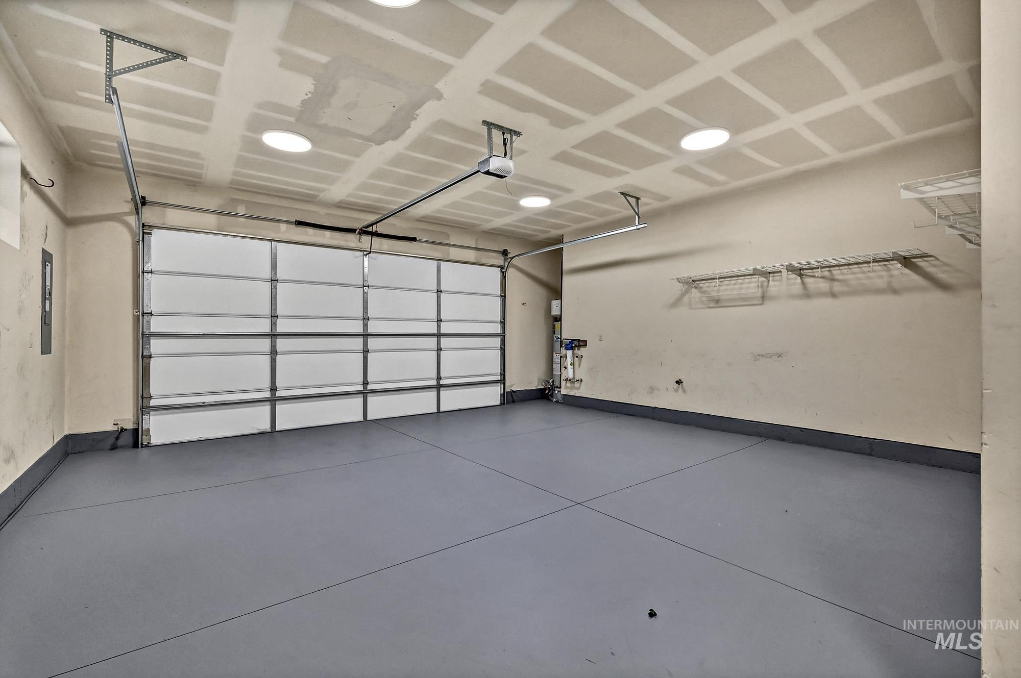 Two-car garage with freshly painted floor.