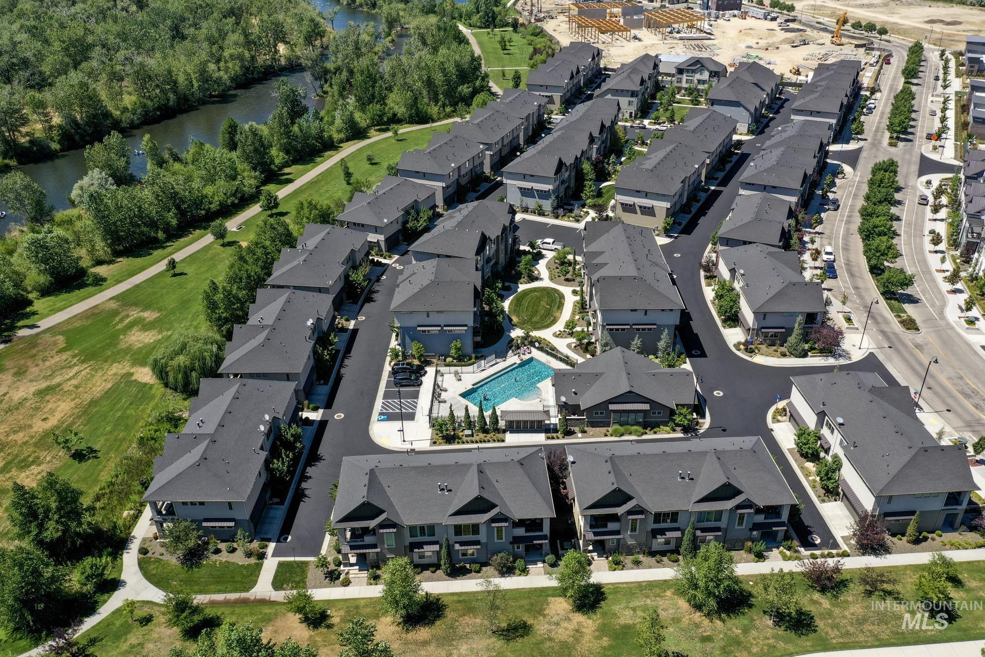 Aerial view which shows the townhome in relation to the Boise Greenbelt, the Boise River, and the community pool.
