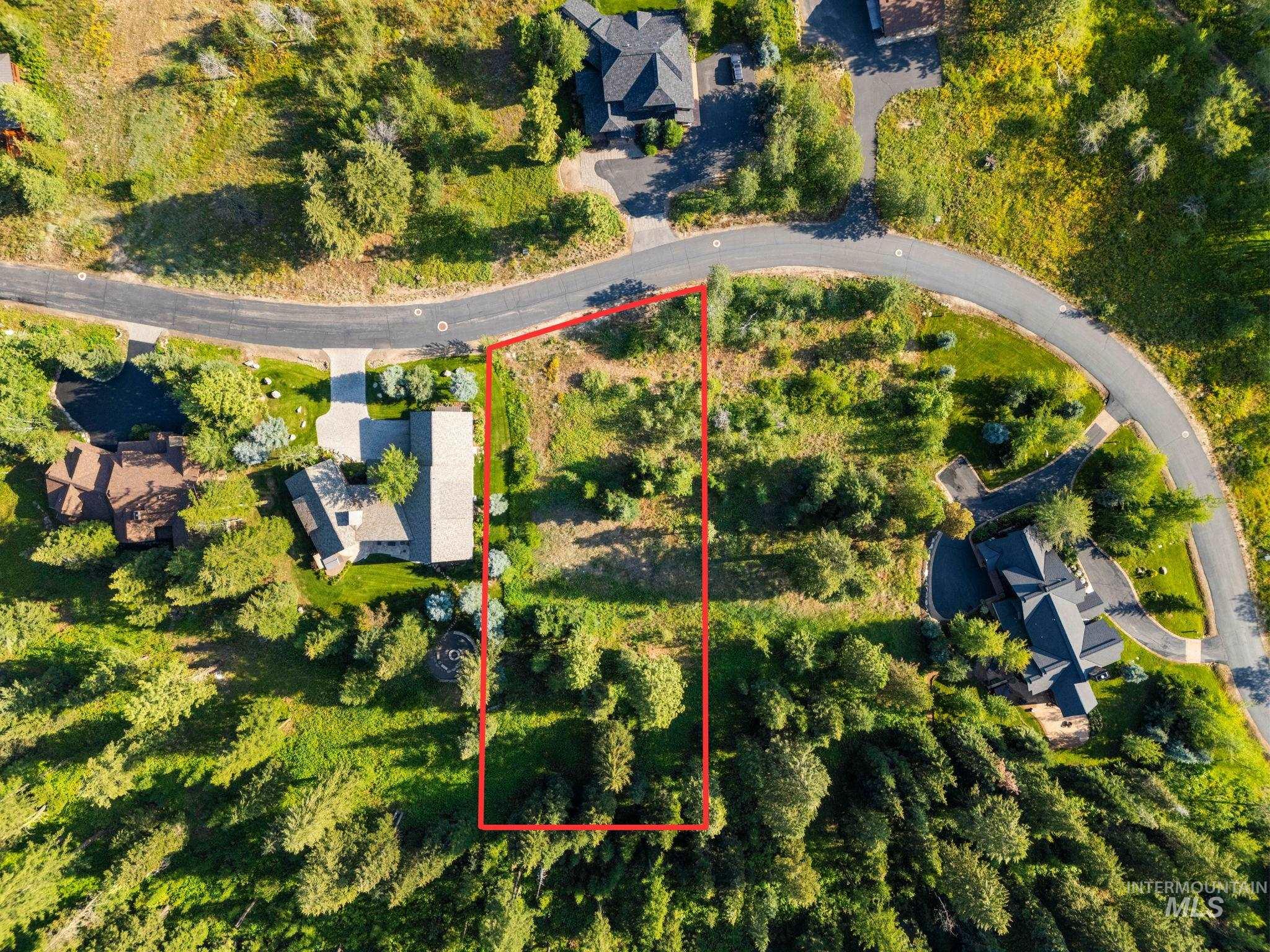 Aerial view of property and surrounding area featuring property boundaries highlighted