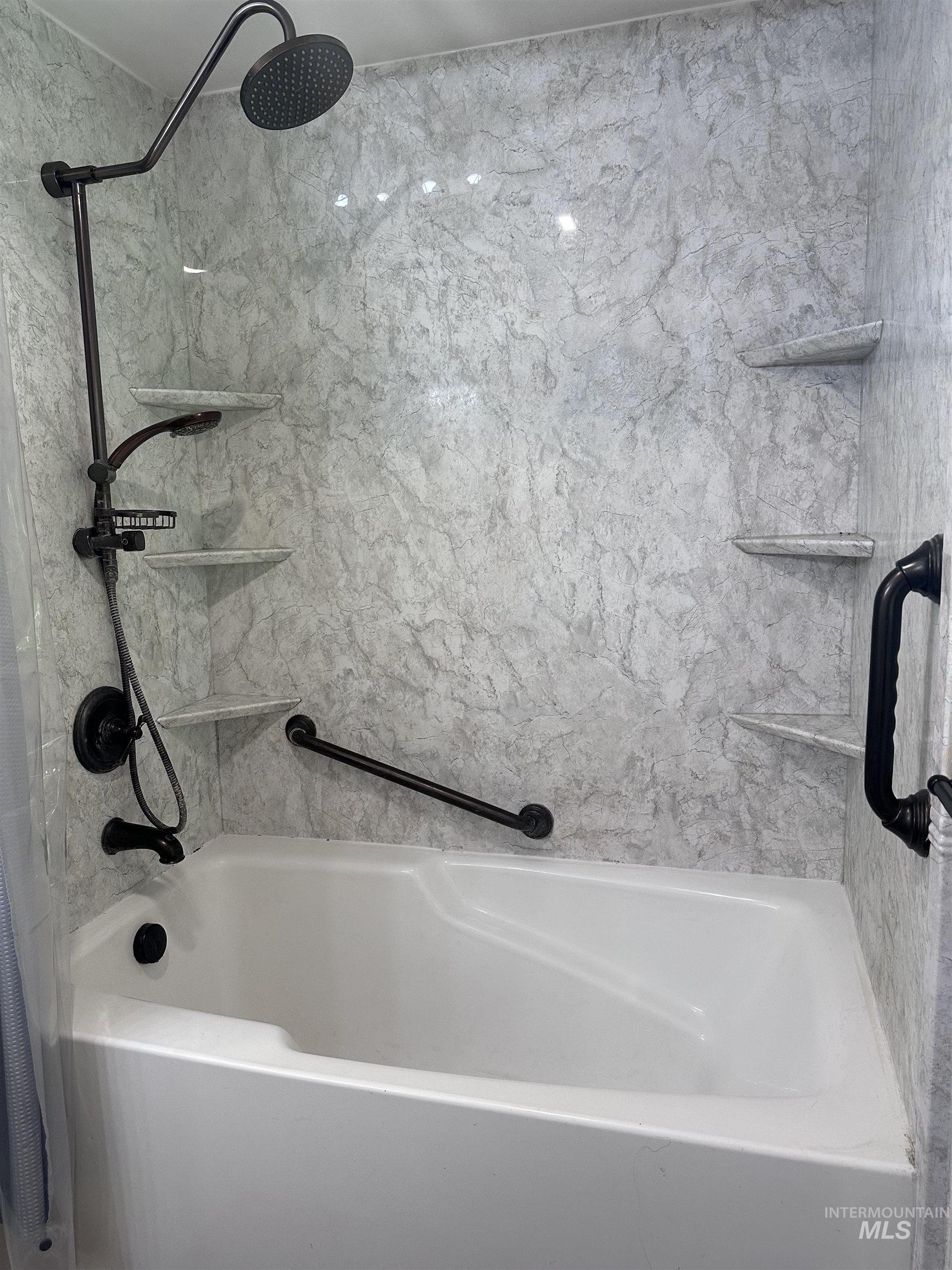 Full bathroom with shower / tub combo