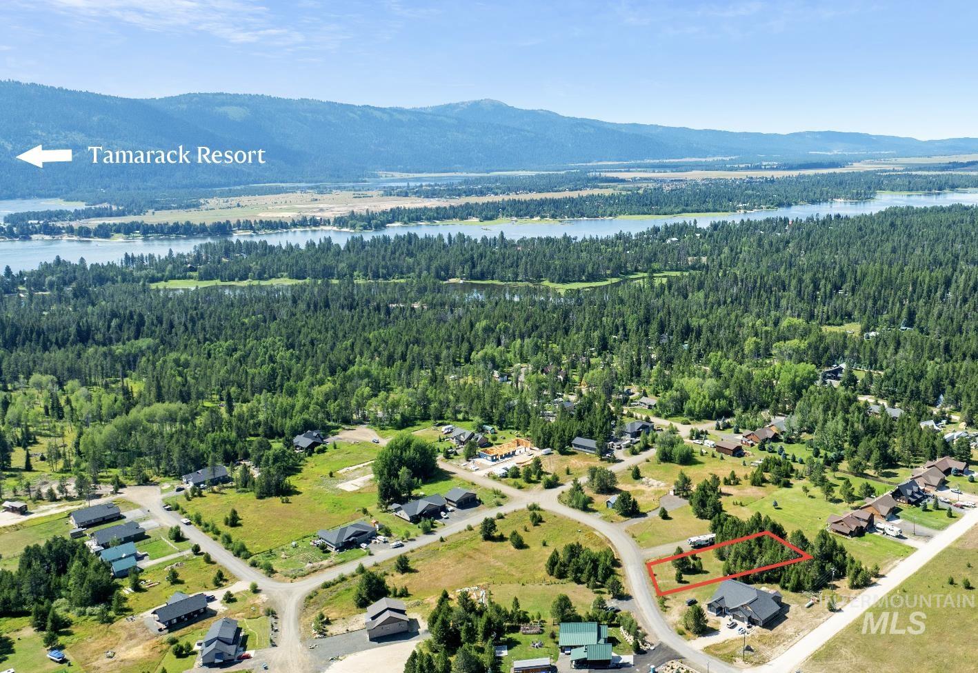 Aerial view of property's location featuring property boundaries highlighted and a water and mountain view