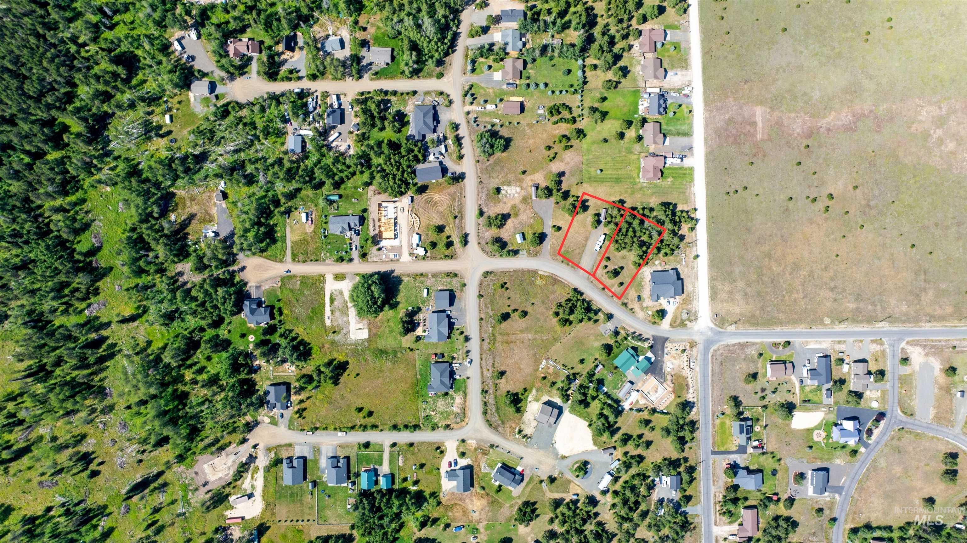 Aerial view of residential area featuring property boundaries highlighted