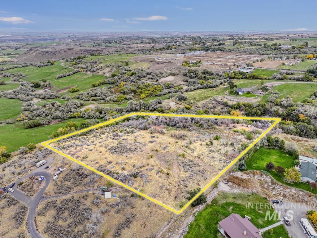 Aerial view of sparsely populated area with property boundaries highlighted