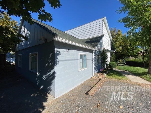 View of side of property with concrete block siding