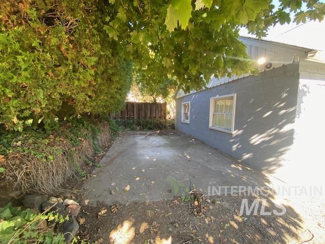View of side of home featuring a patio area