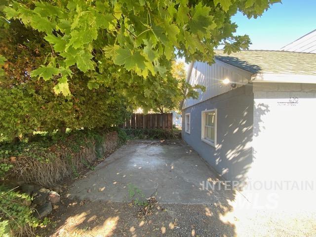 View of side of home featuring a patio