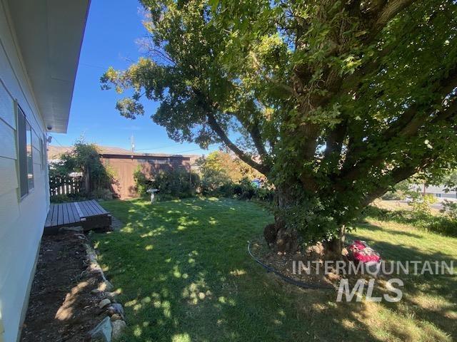 View of yard featuring a wooden deck