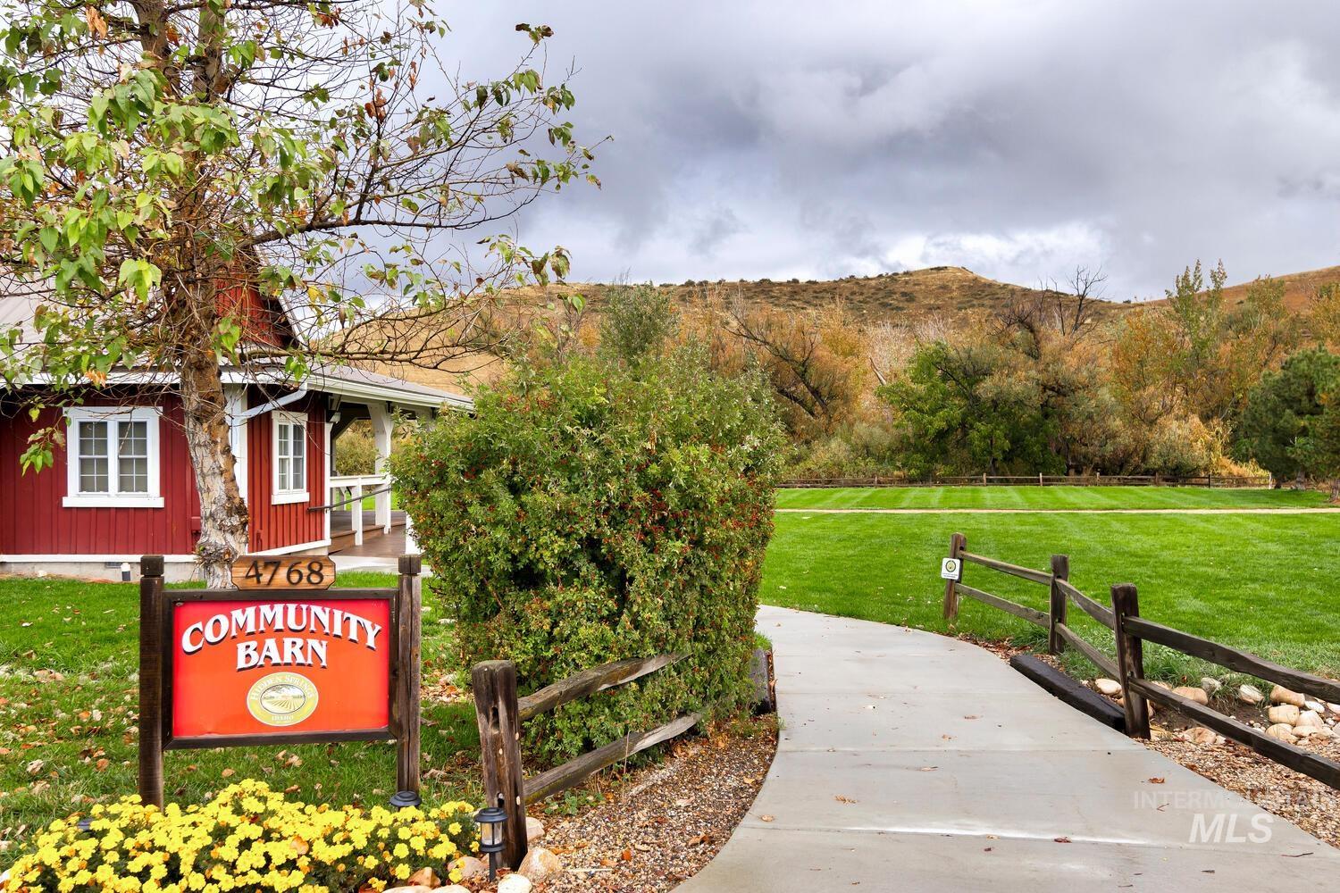 Surrounding community featuring a lawn and a mountain view