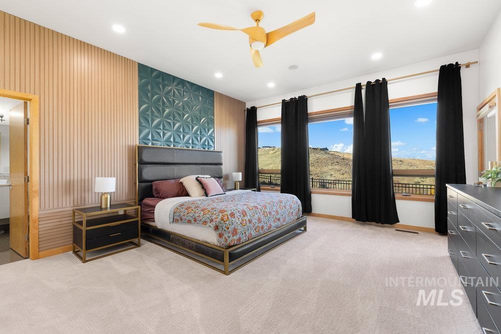 Bedroom with a ceiling fan, recessed lighting, and light carpet