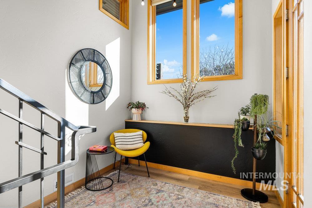 Living area featuring light wood-style floors and baseboards