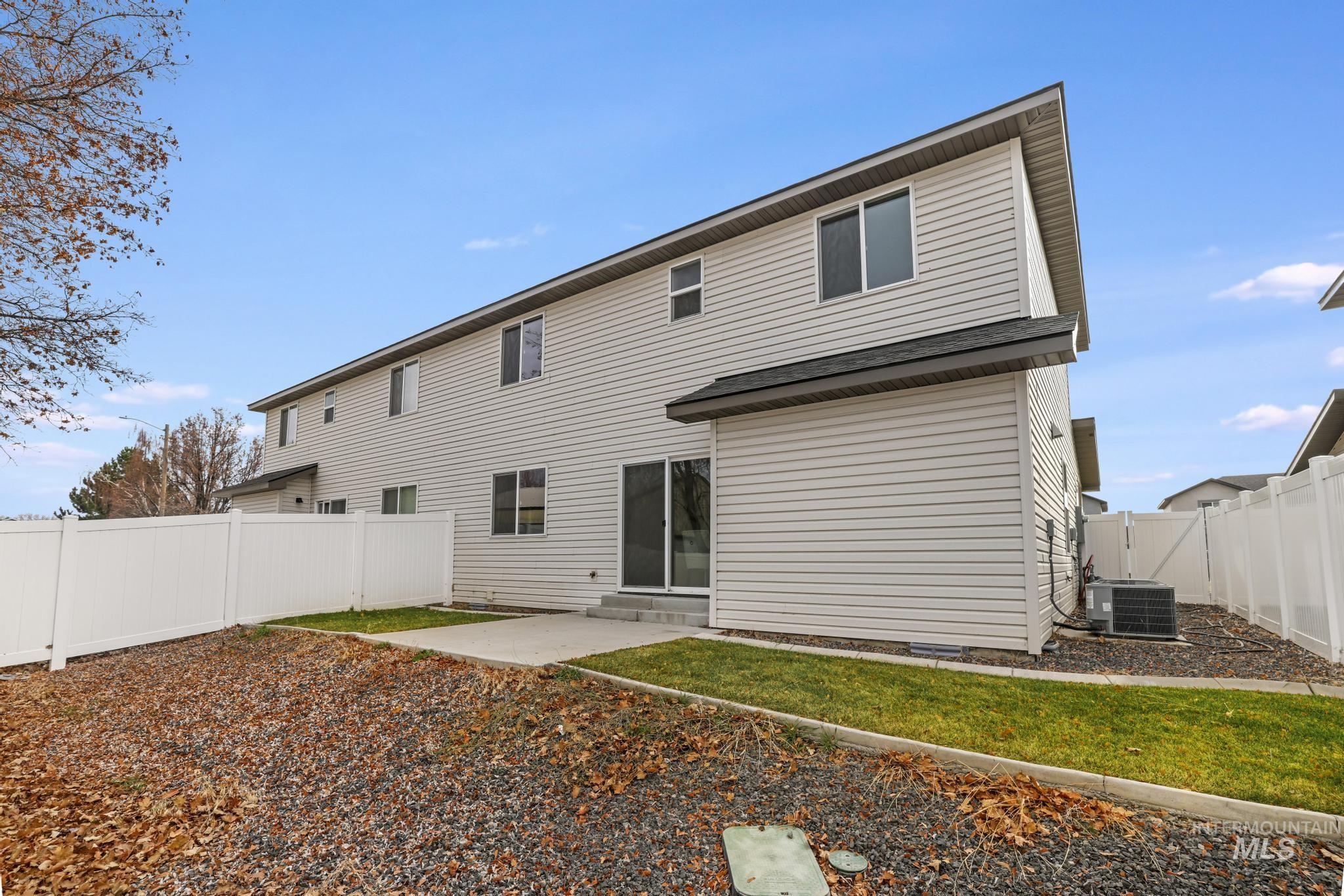 Back of property featuring a patio area and a fenced backyard