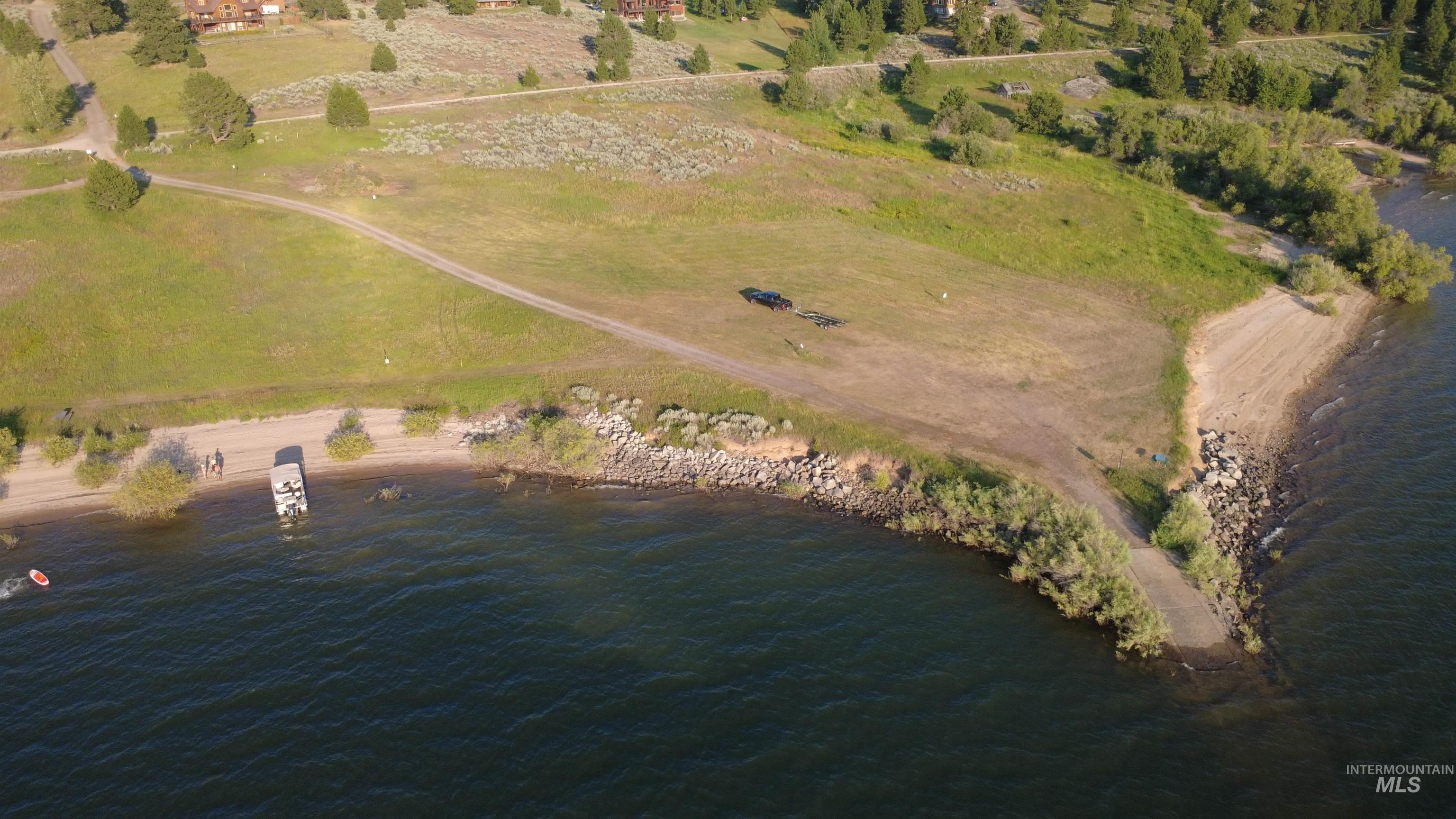 Aerial overview of property's location featuring a large body of water
