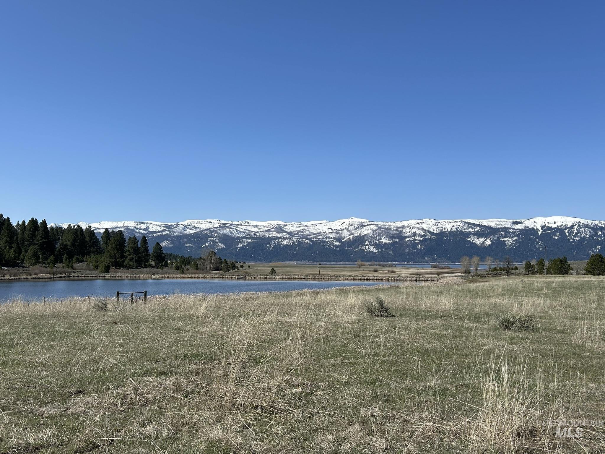 Water view featuring a mountain backdrop and rural landscape