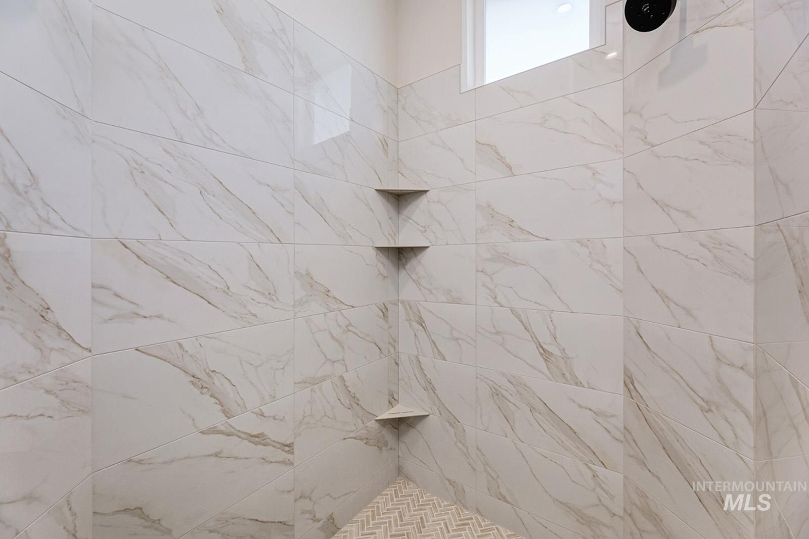 Full bathroom featuring tiled shower