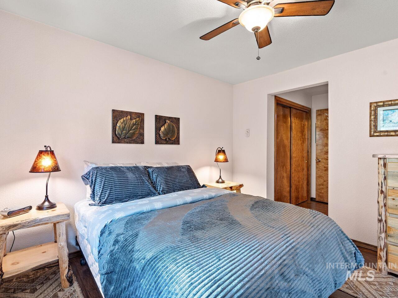 Bedroom with wood finished floors and ceiling fan