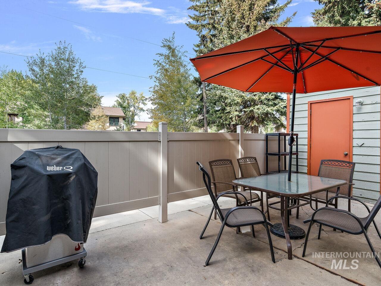 View of patio / terrace featuring grilling area and outdoor dining area