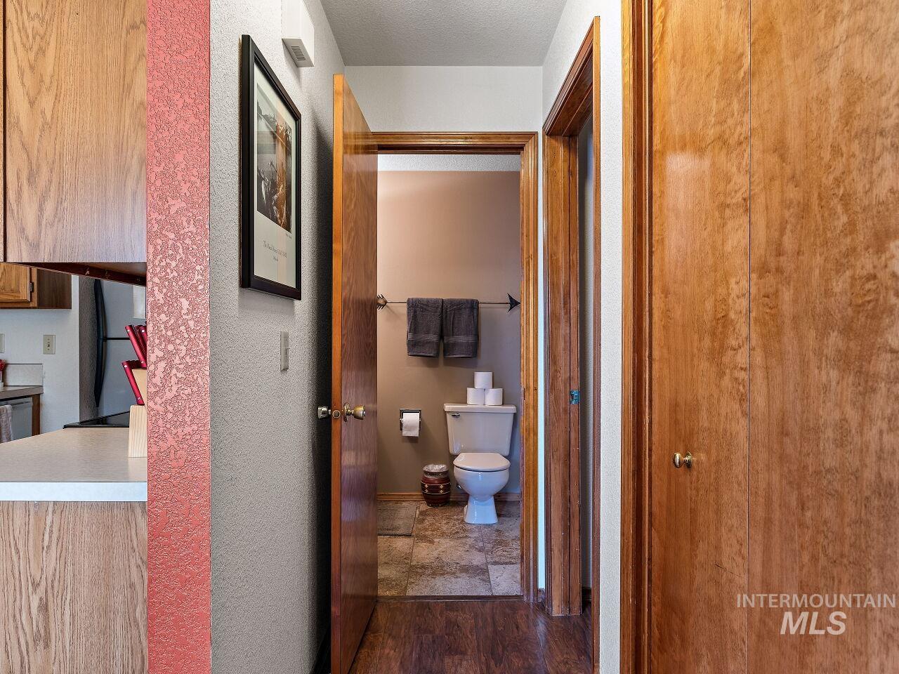 Hall with dark wood-type flooring