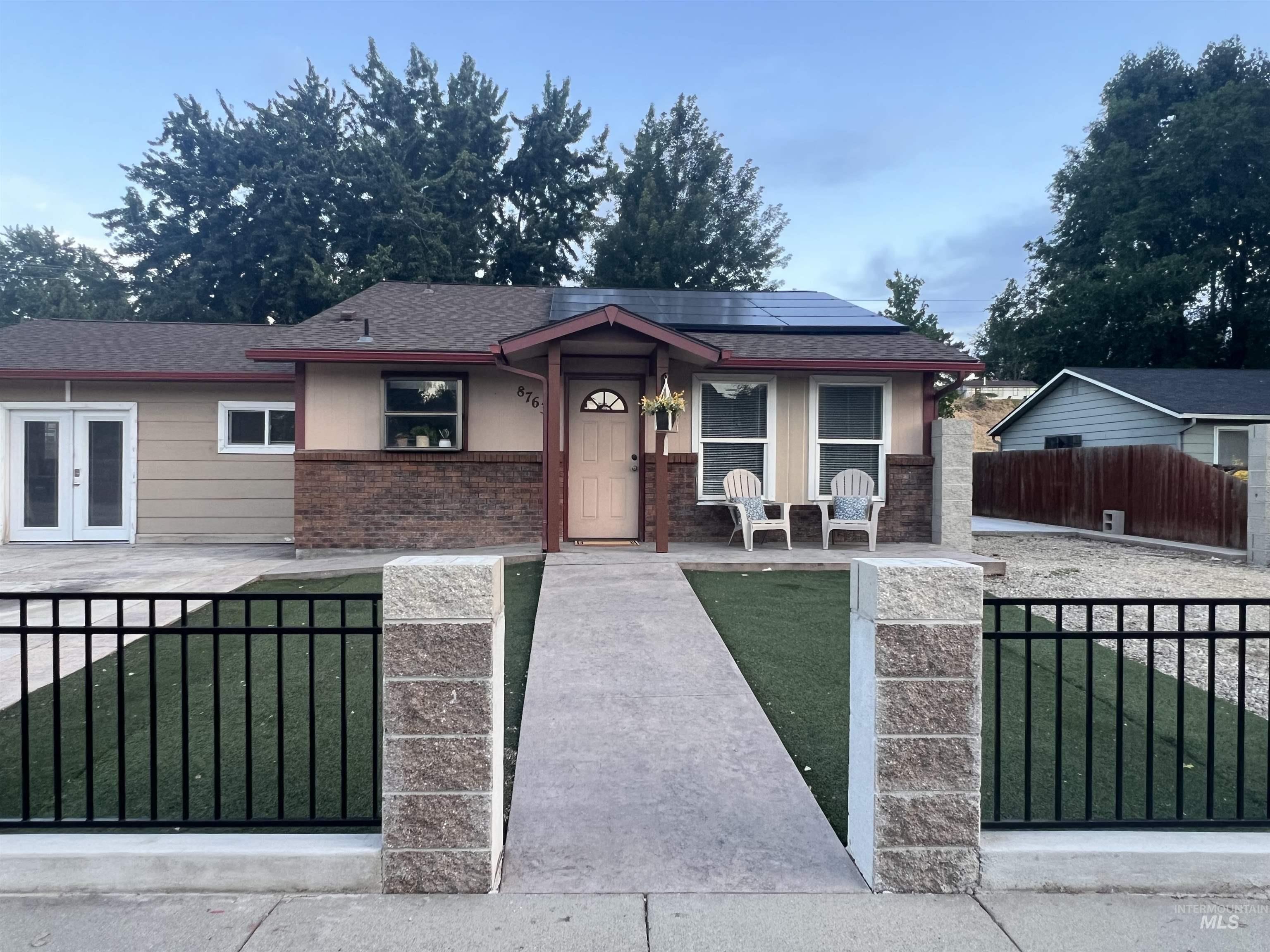 Single-story residence featuring a covered front entry and a combination of siding and brick veneer