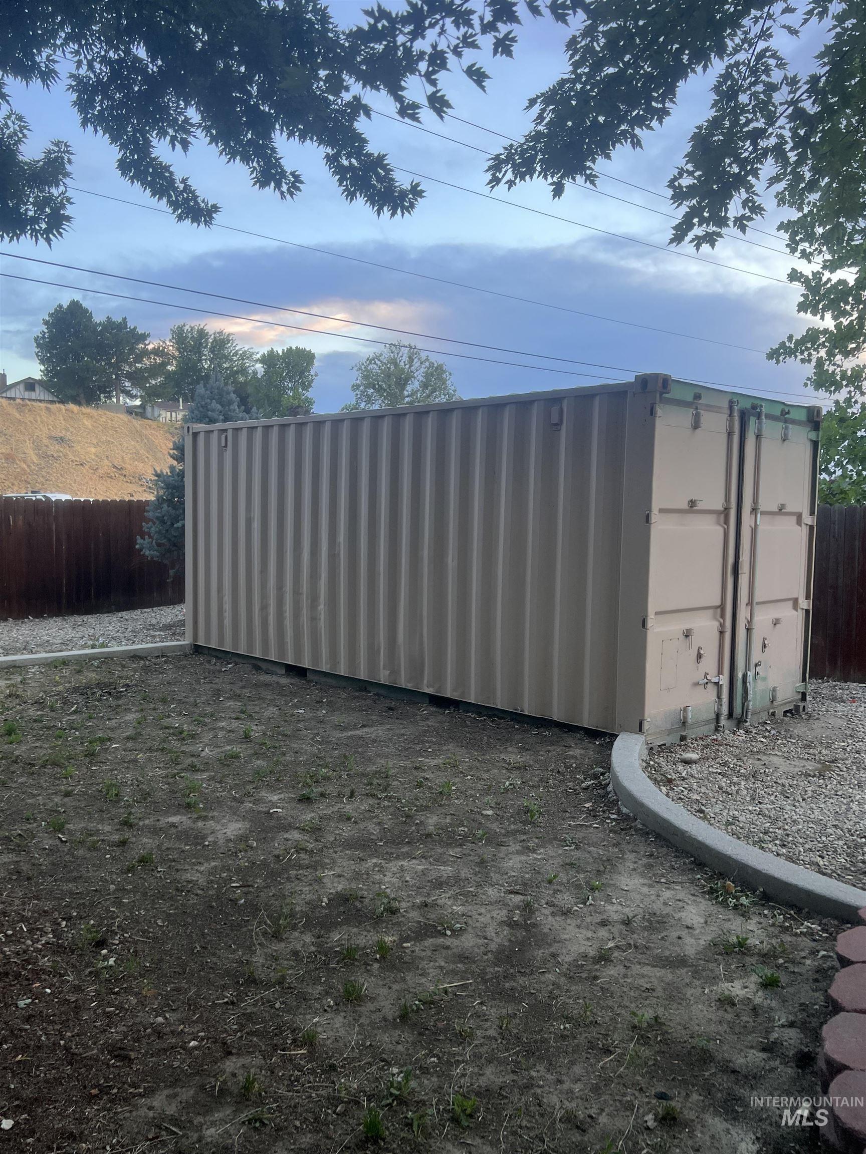 Large, corrugated metal Conex storage container with rear double doors measuring 8' x 20'. Tons of possibilities.