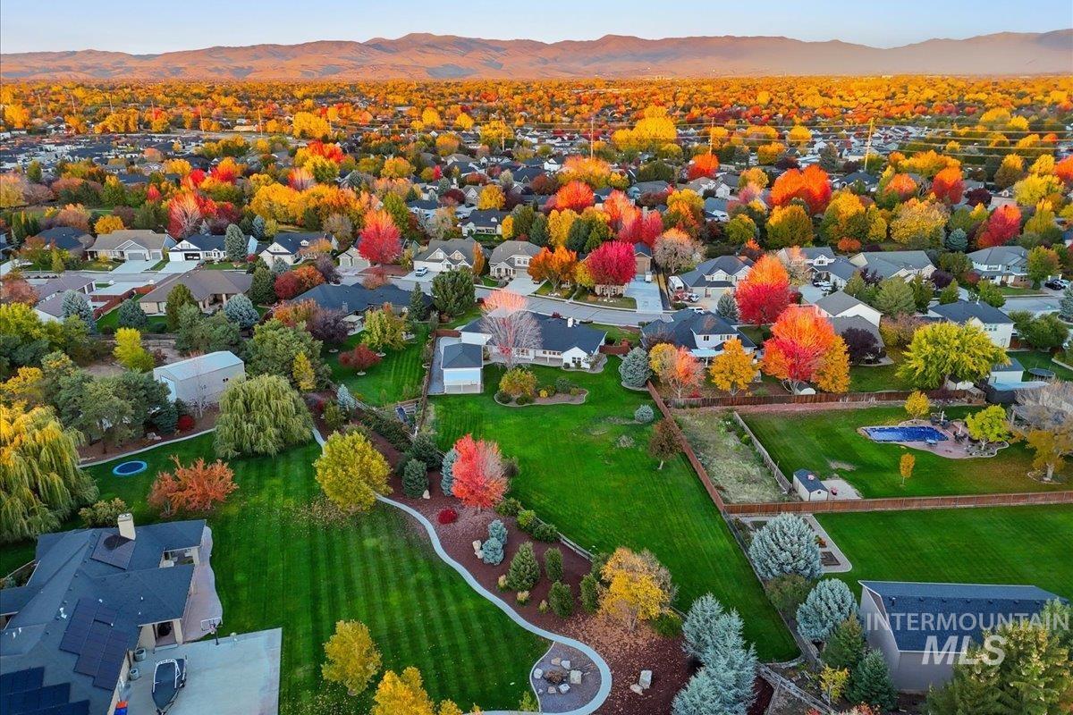 Aerial view of residential area featuring a mountain backdrop