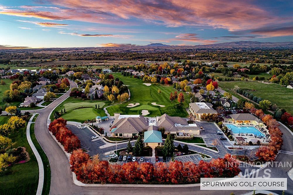 Aerial view at dusk of golf course view and a mountain view