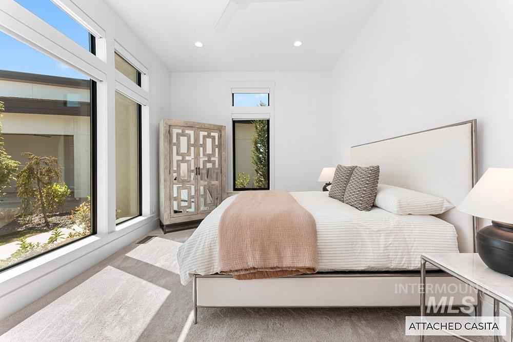 Bedroom with multiple windows and recessed lighting