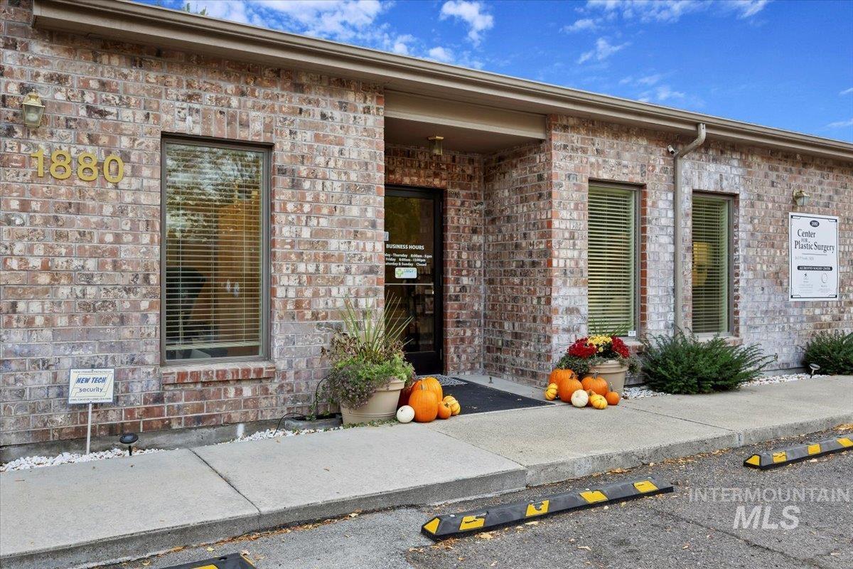 Entrance to property with brick siding