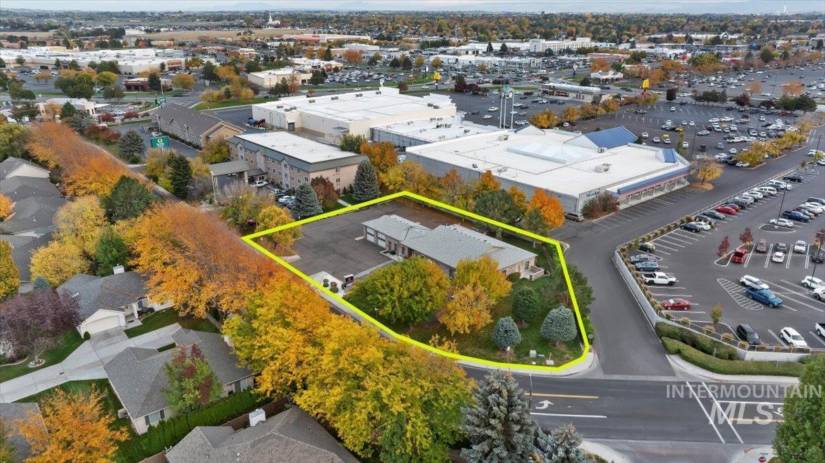 Aerial view of property and surrounding area with property boundaries highlighted