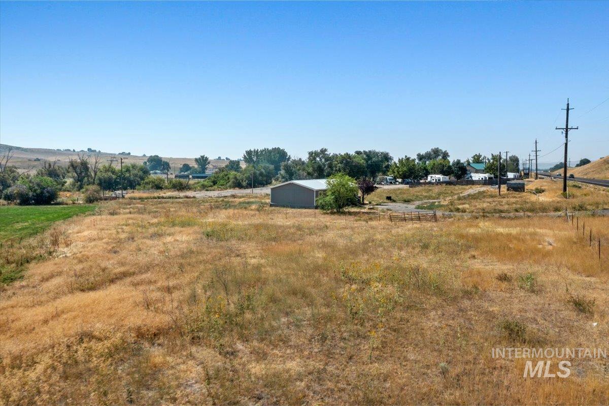 View of yard featuring a view of countryside and an outbuilding