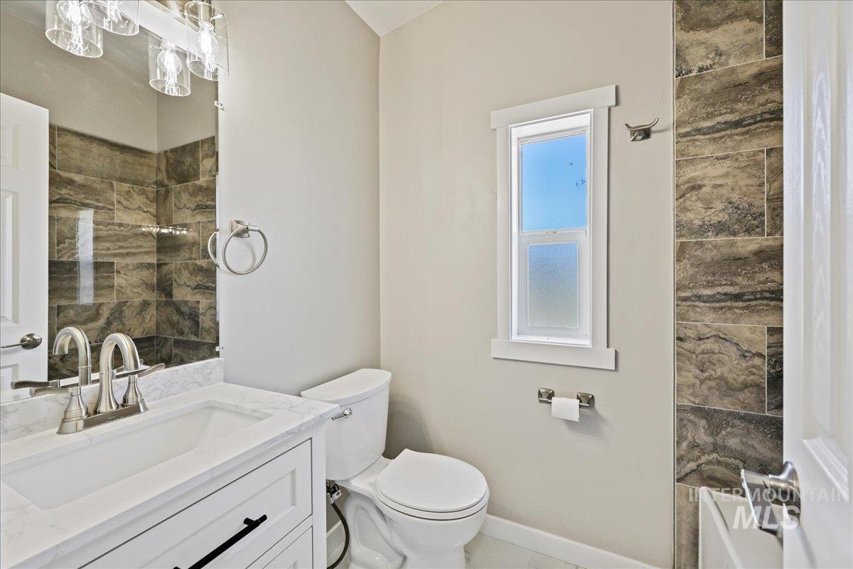 Full bath with vanity and toilet
