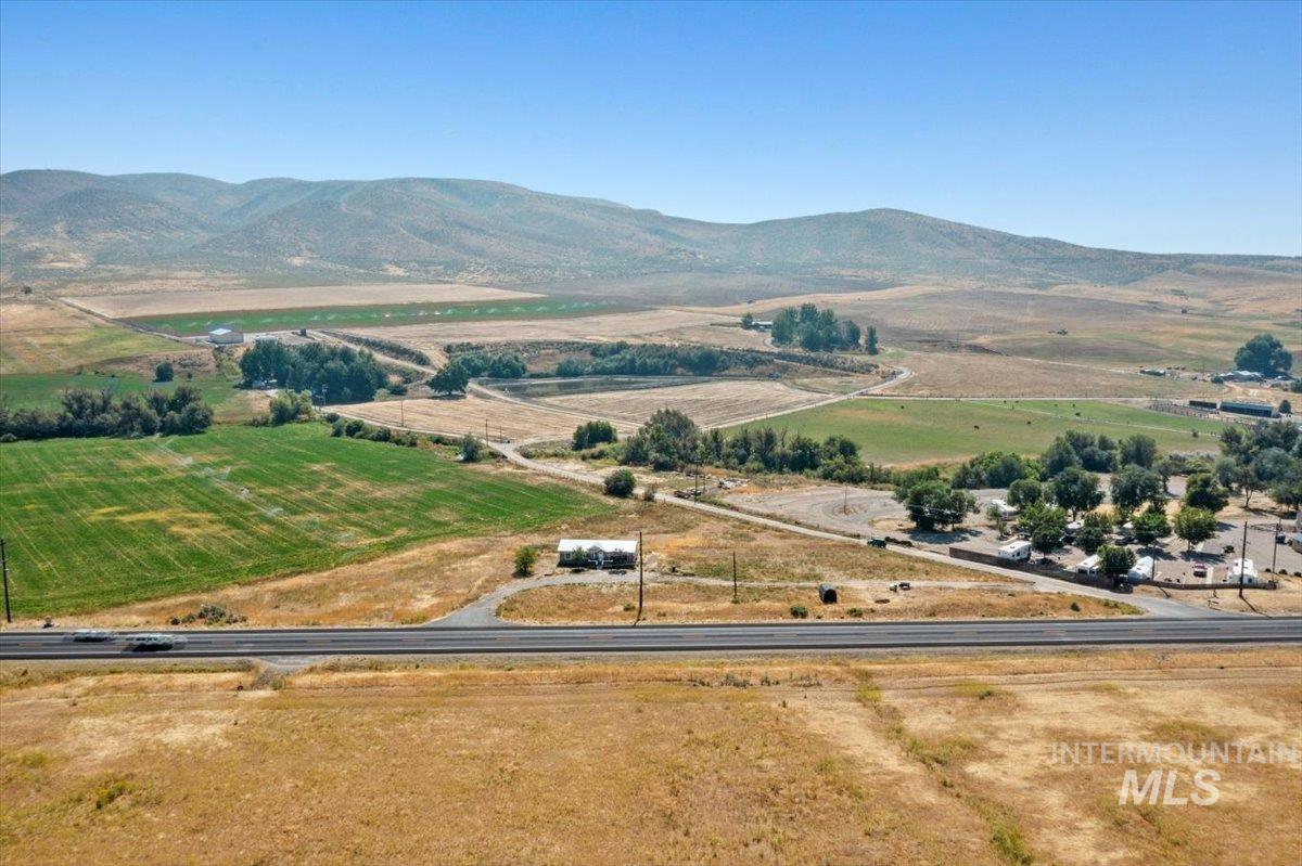 Overview of rural landscape featuring a mountain backdrop