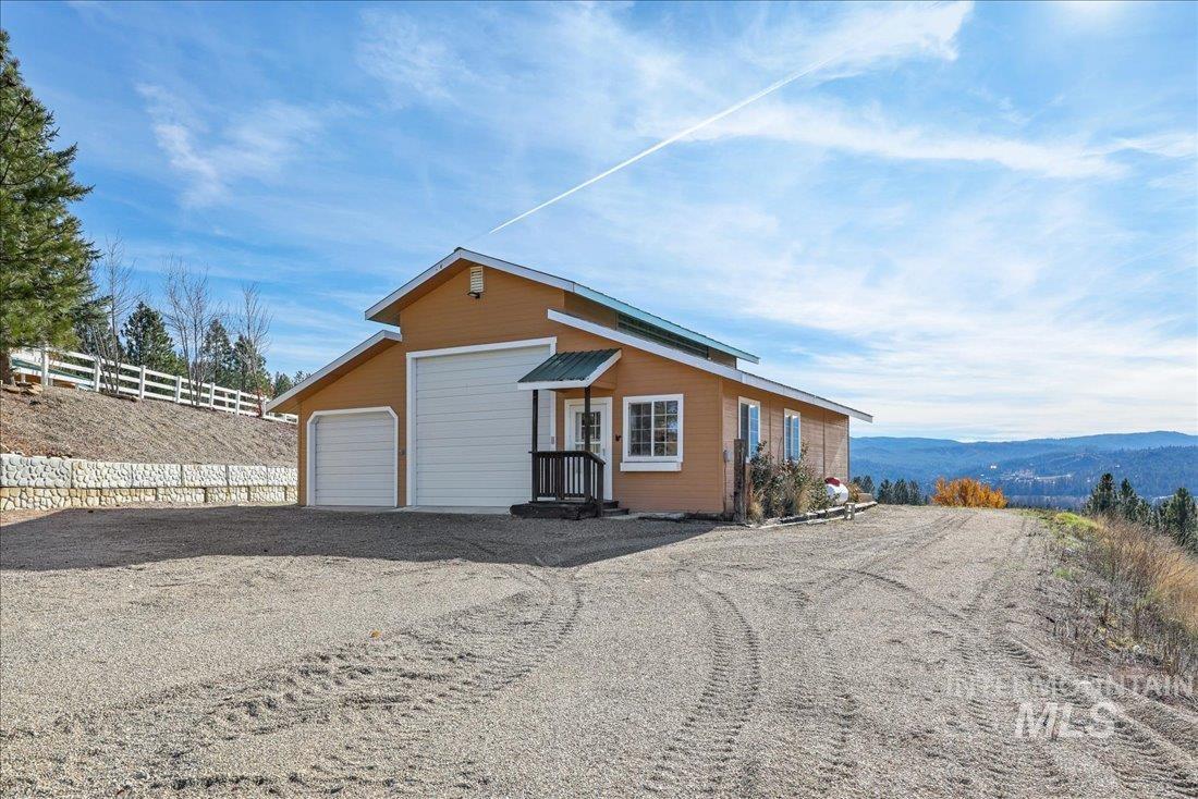 View of outbuilding with a garage