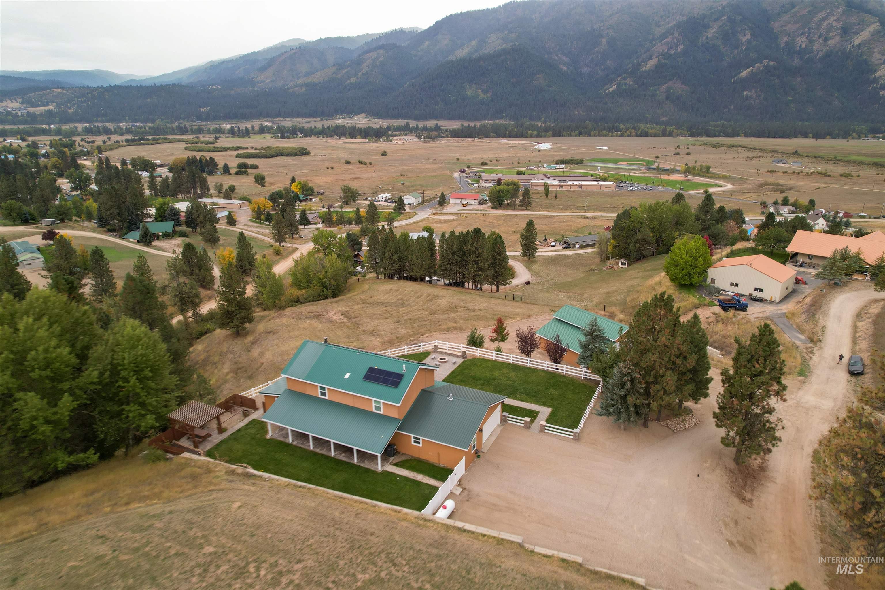 Aerial view of sparsely populated area featuring a mountainous background