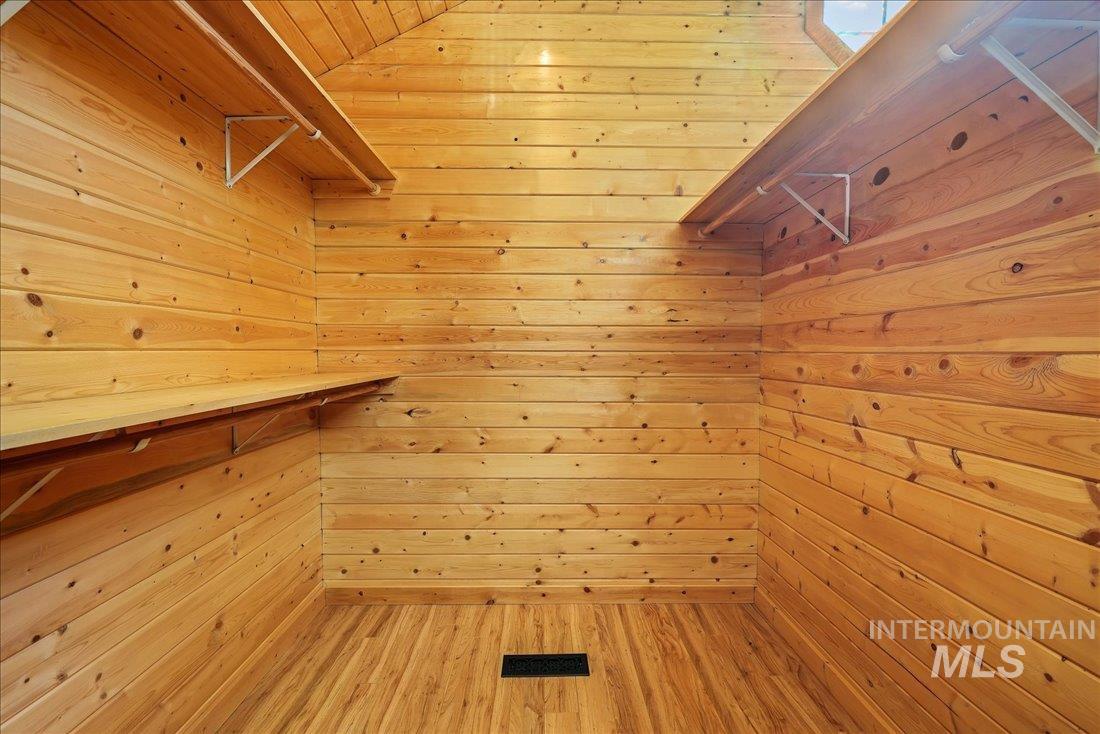 Spacious closet featuring light wood finished floors