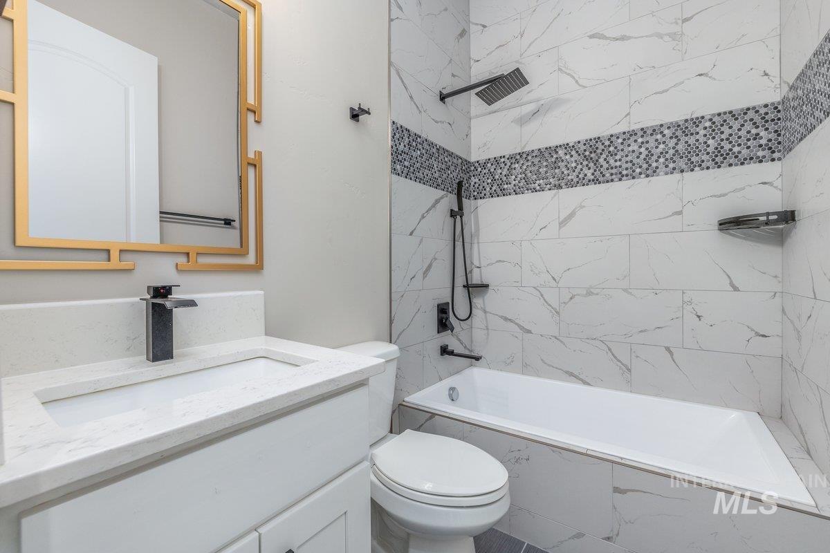 Full bath with shower / bathtub combination and vanity