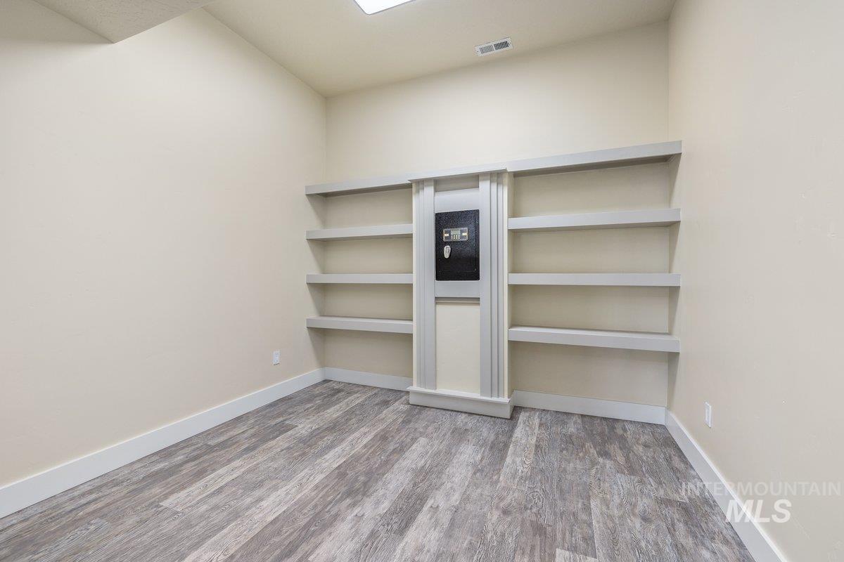 Unfurnished bedroom featuring light wood-style flooring and baseboards