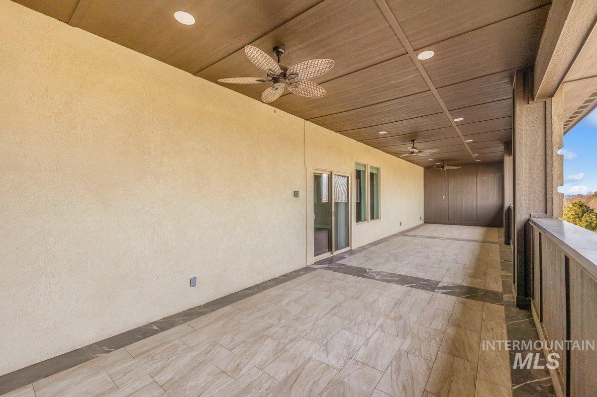 View of patio with a ceiling fan