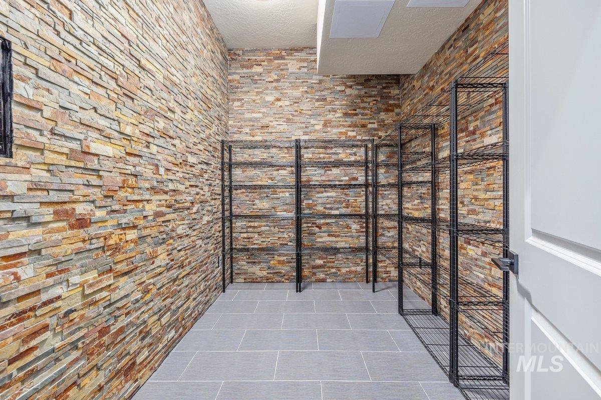 Wine room with a textured ceiling