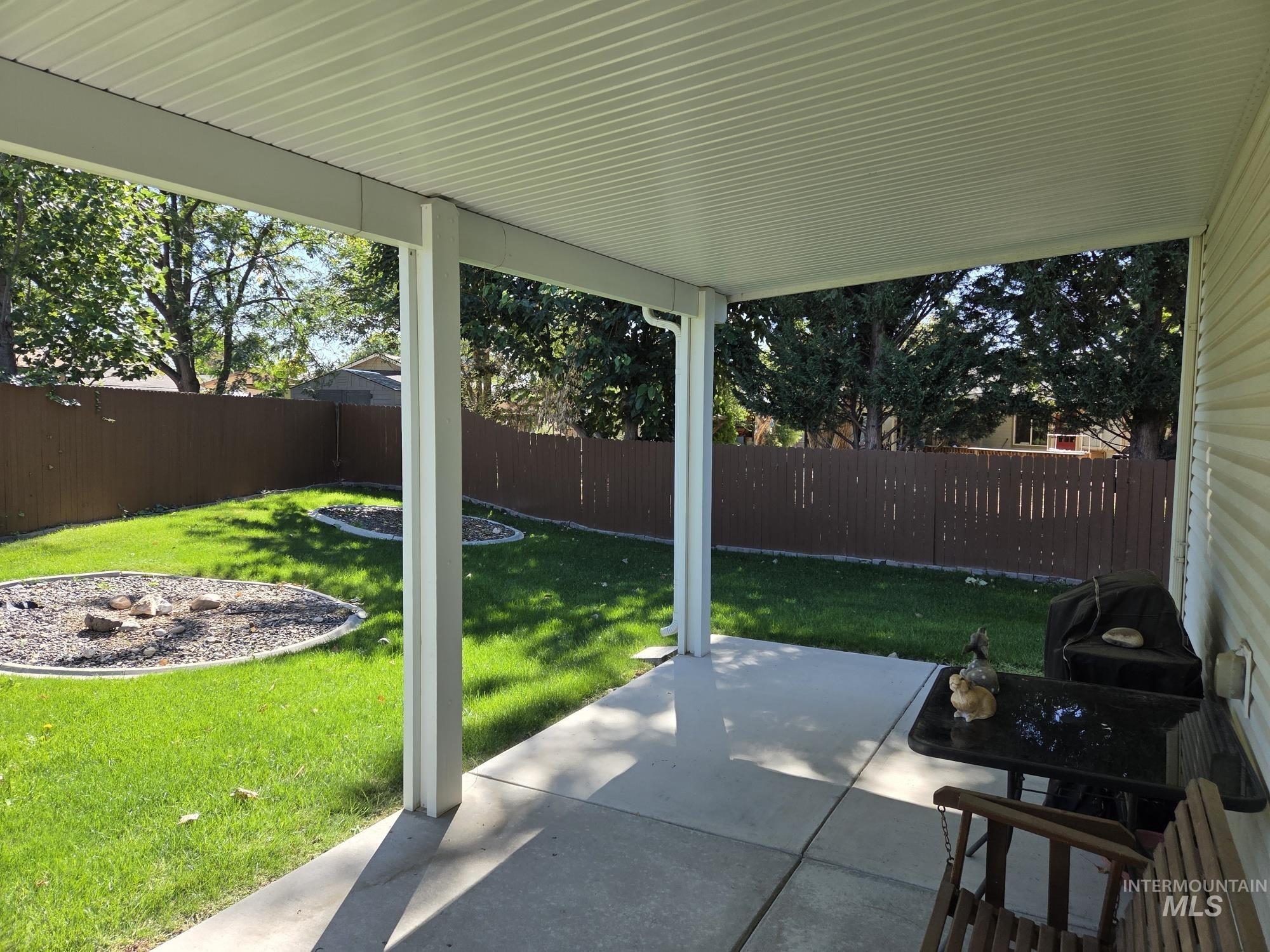Fenced backyard featuring a patio area