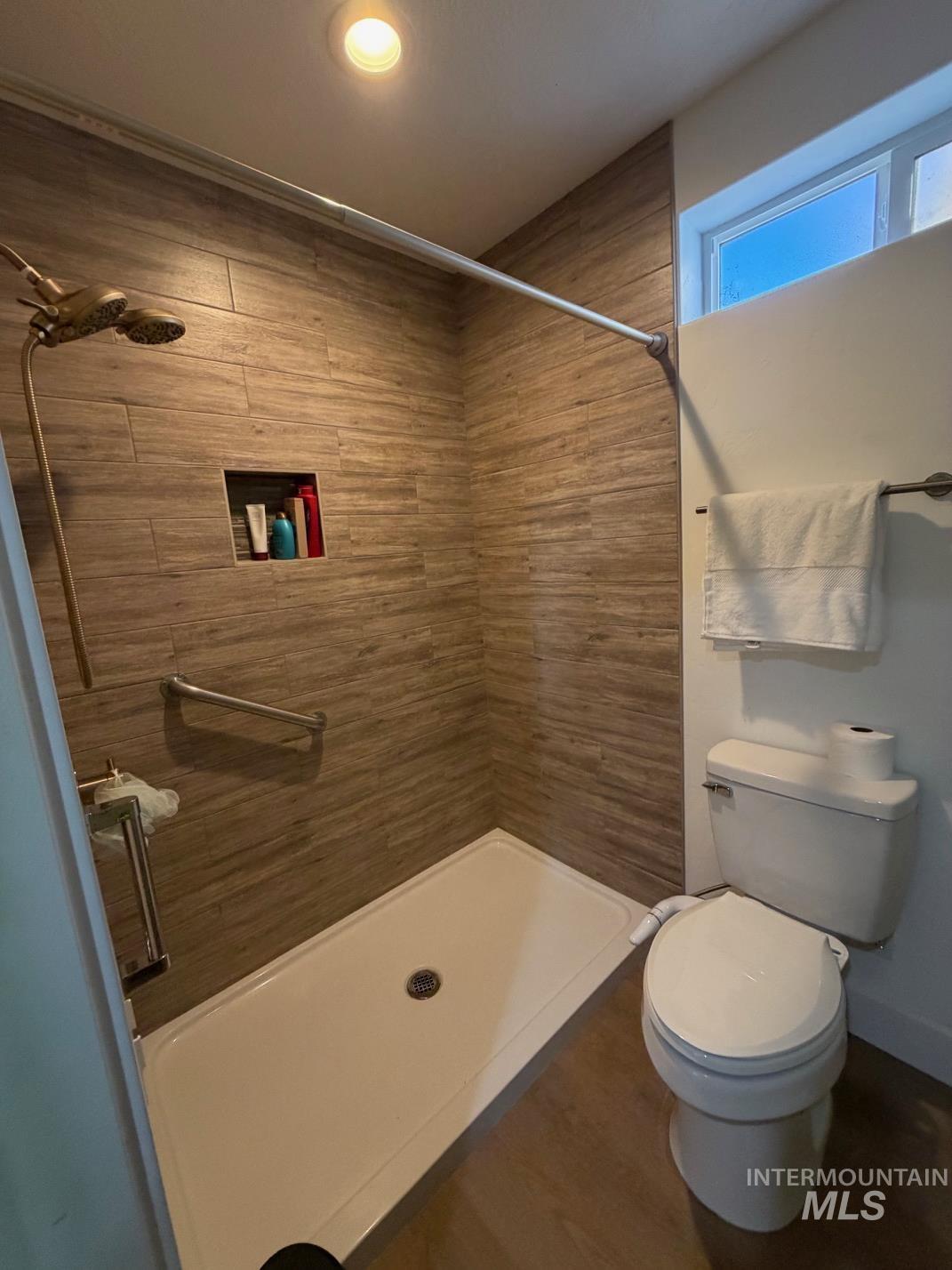 Bathroom featuring a stall shower and recessed lighting