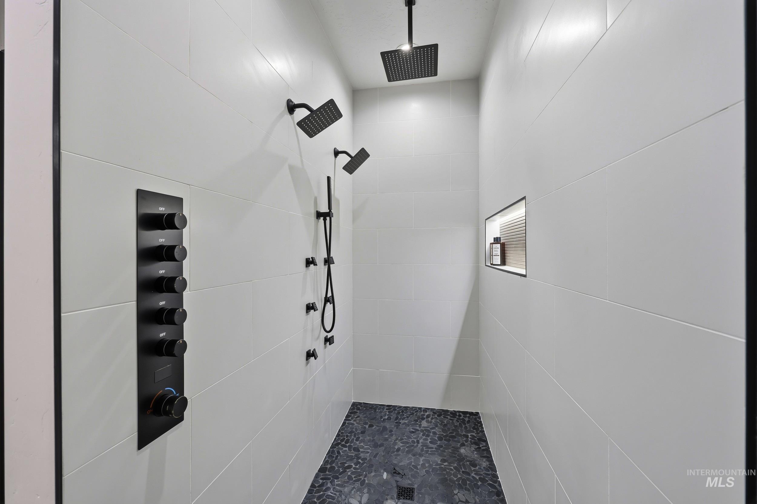 Full bath with a tile shower