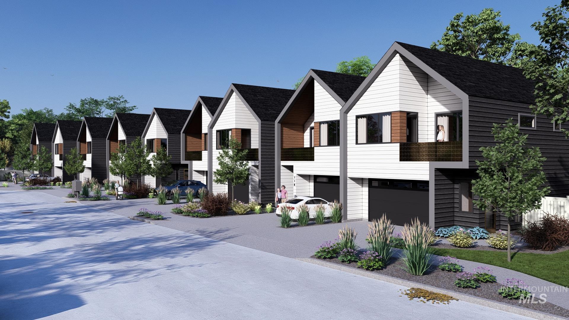 View of front of home with a residential view, a garage, and driveway
