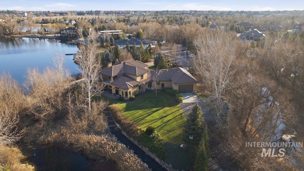 Aerial overview of property's location featuring a large body of water