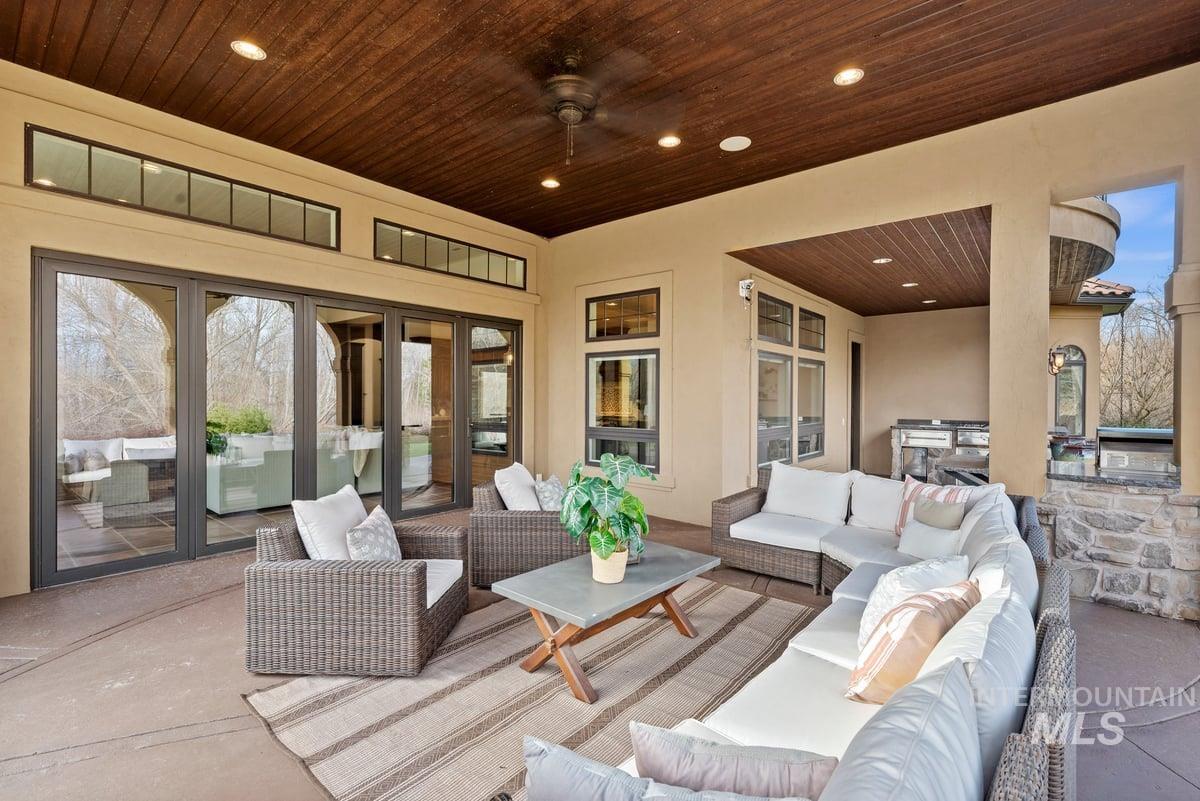 View of patio with an outdoor kitchen and an outdoor hangout area
