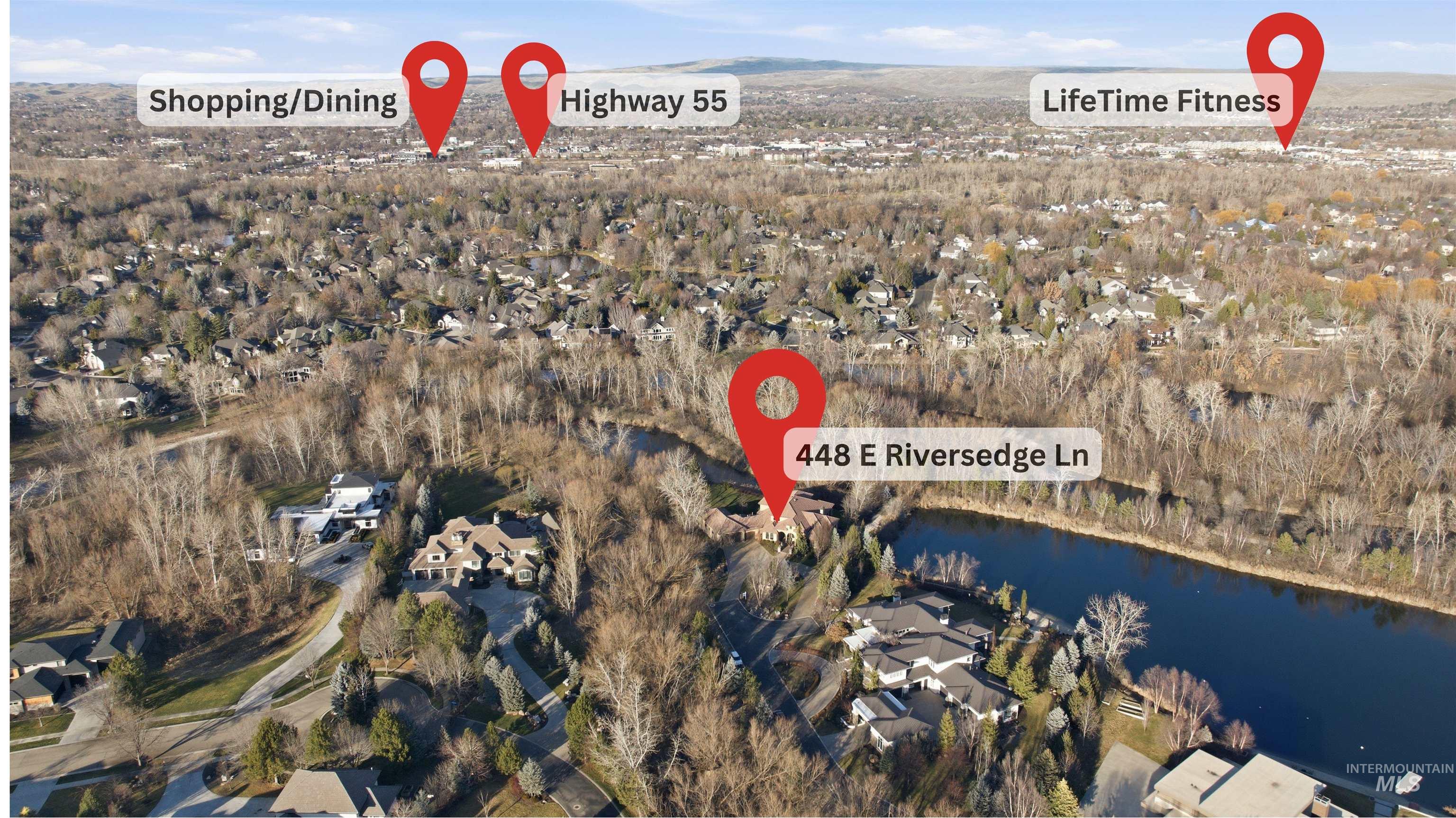 Aerial view of property's location featuring nearby suburban area and a nearby body of water