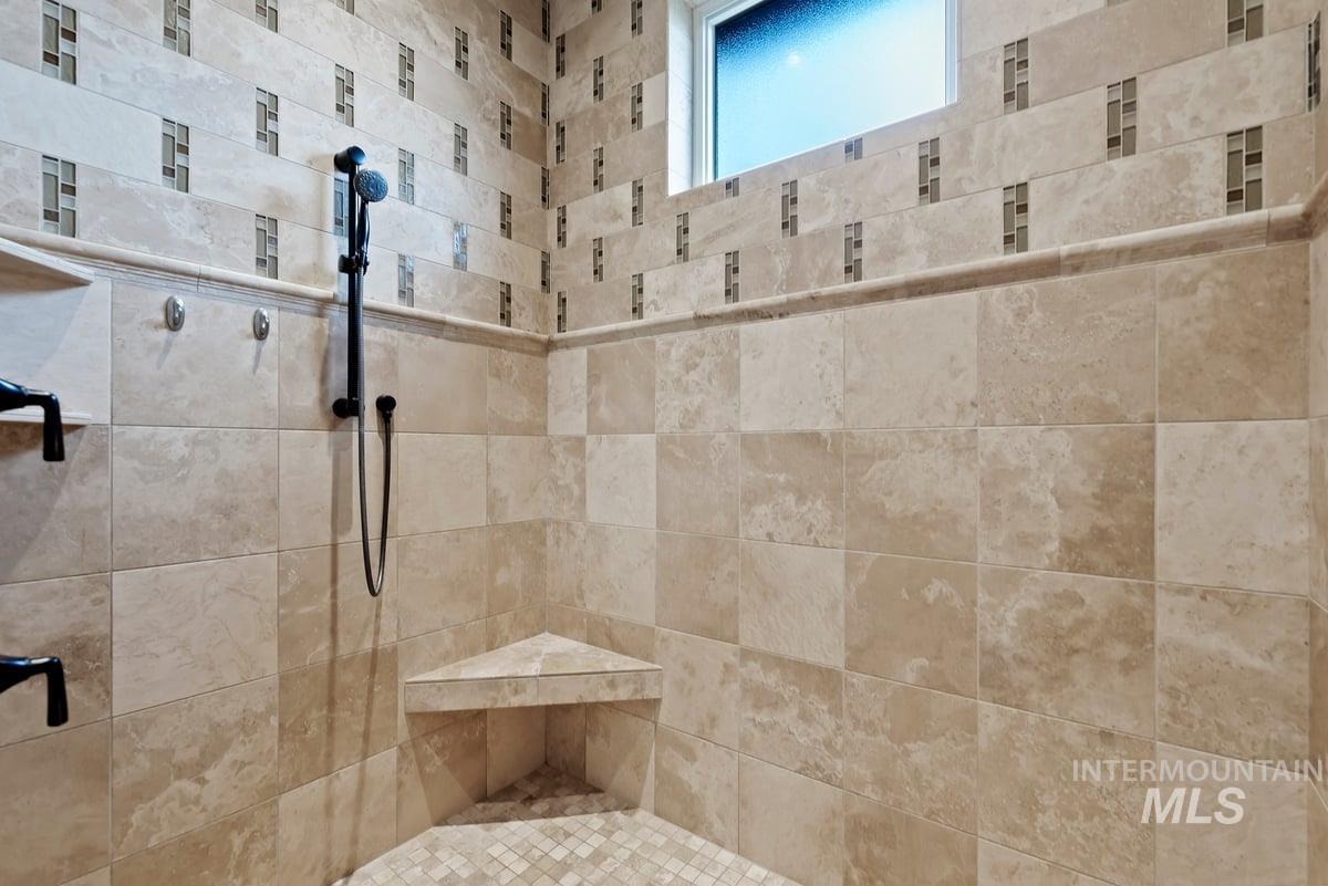 Full bath with tiled shower