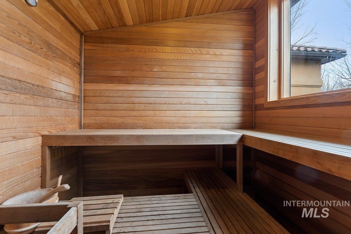 Relaxing sauna / steam room with wood walls and wooden ceiling